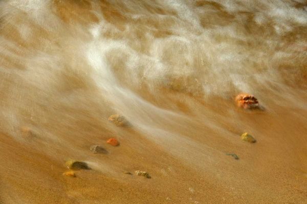 Canada, Ontario Waves crashing against pebbles